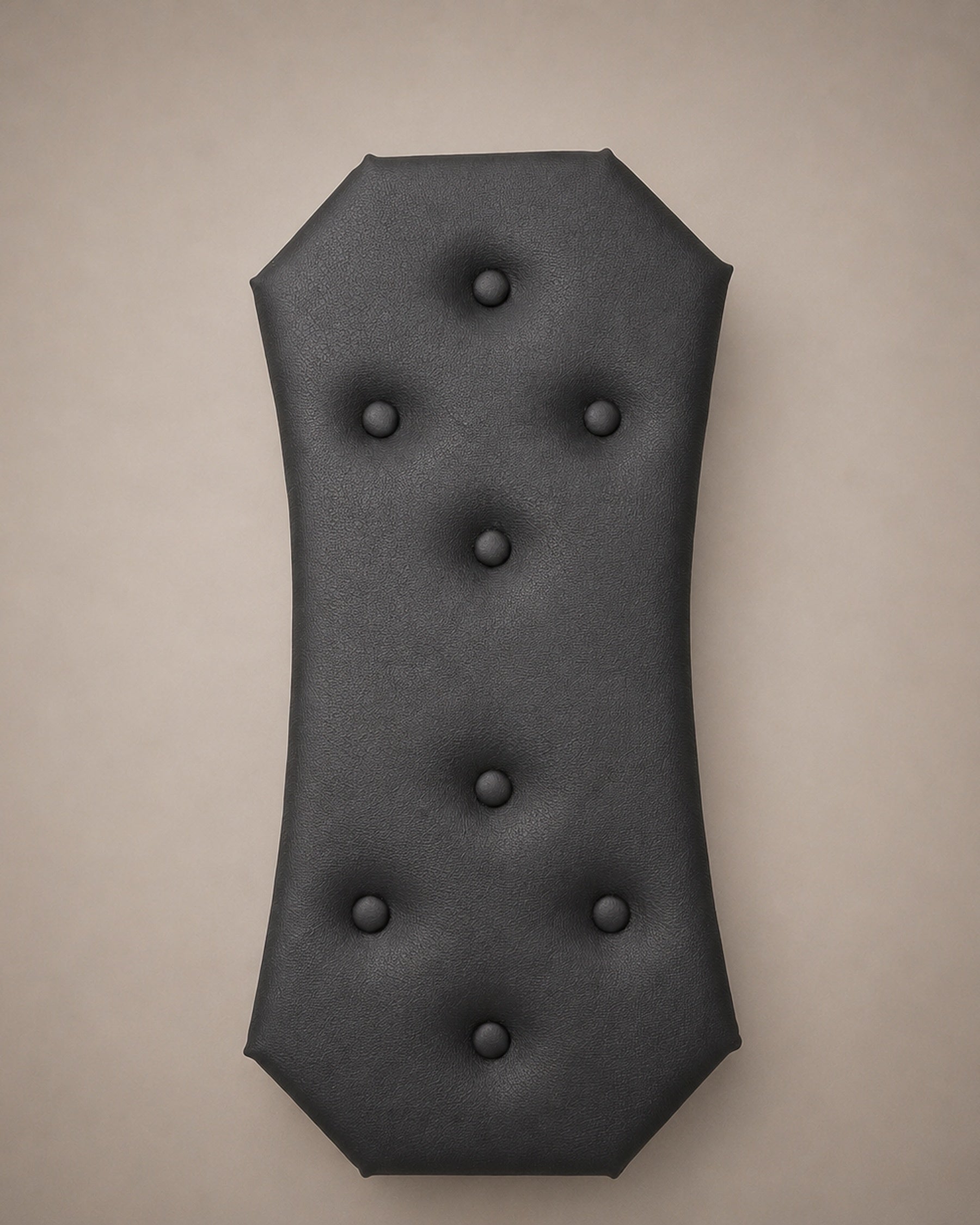 Close-up of the black eco-leather central panel with button tufting for a modular wall-mounted St. Andrew’s Cross