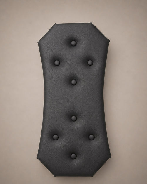 Close-up of the black eco-leather central panel with button tufting for a modular wall-mounted St. Andrew’s Cross