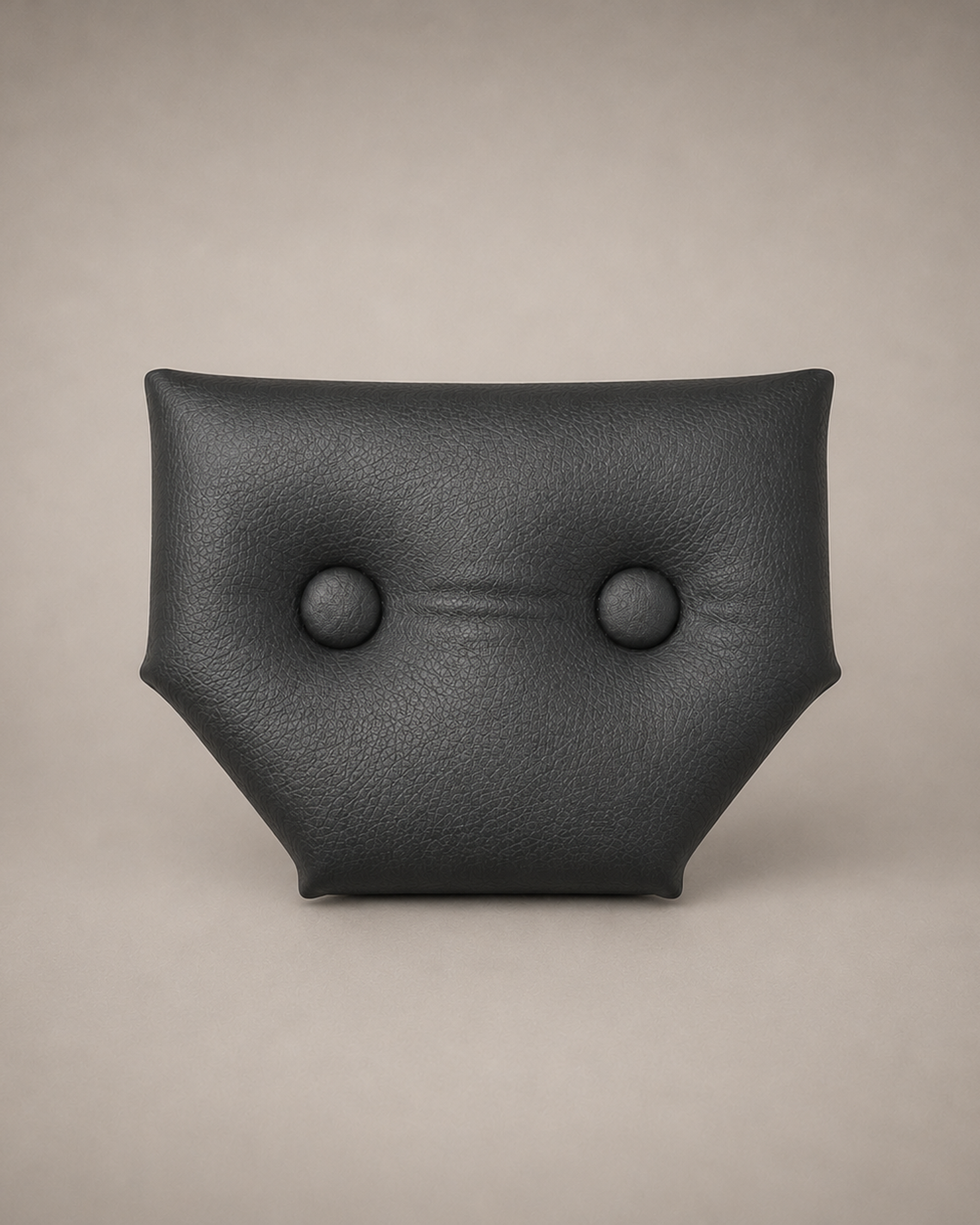 Close-up of the small black eco-leather headrest with two upholstered buttons for a modular wall-mounted St. Andrew’s Cross